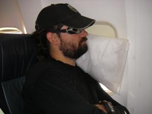 Ken sleeping on an airplane